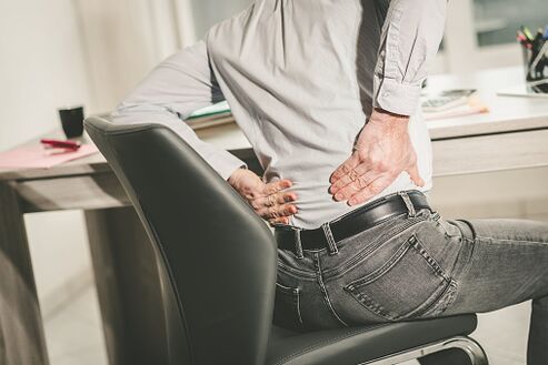 pain in the lower back in a man